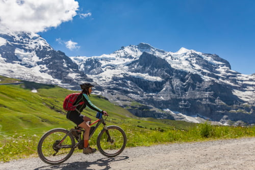 woman cycling in mountains on holiday